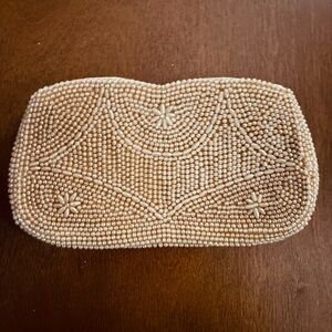 Elegant Pearl-Trimmed Beige Clutch